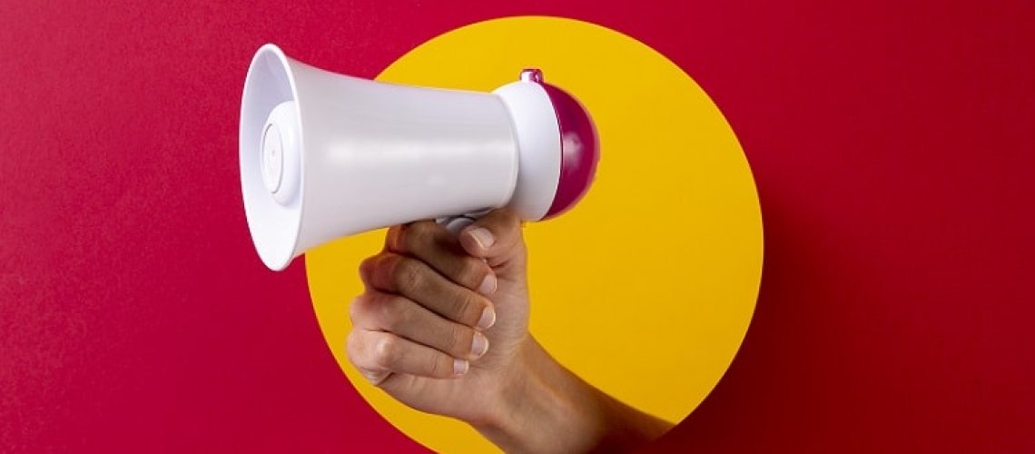 close-up-hand-holding-megaphone